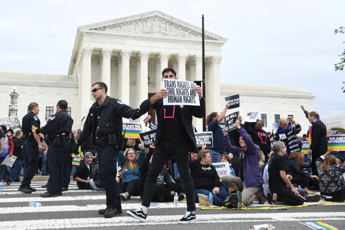 Demonstrators in favor of LGBT rights rally outside the US Supreme Court in Washington, on Oct. 8, 2019. (Saul Loeb/AFP via Getty Images)