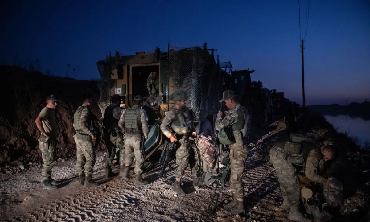 First group of Turkish infantry prepare to enter Syria on the border between Turkey and Syria in Akcakale, Turkey on Oct. 9, 2019. (Burak Kara/Getty Images)