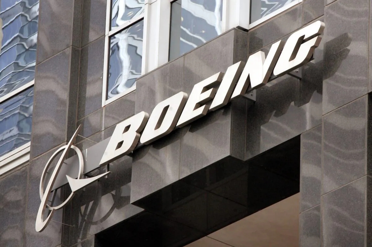 The Boeing logo hangs on the corporate world headquarters building of Boeing in Chicago, Ill. on Nov. 28, 2006. (Scott Olson/Getty Images)