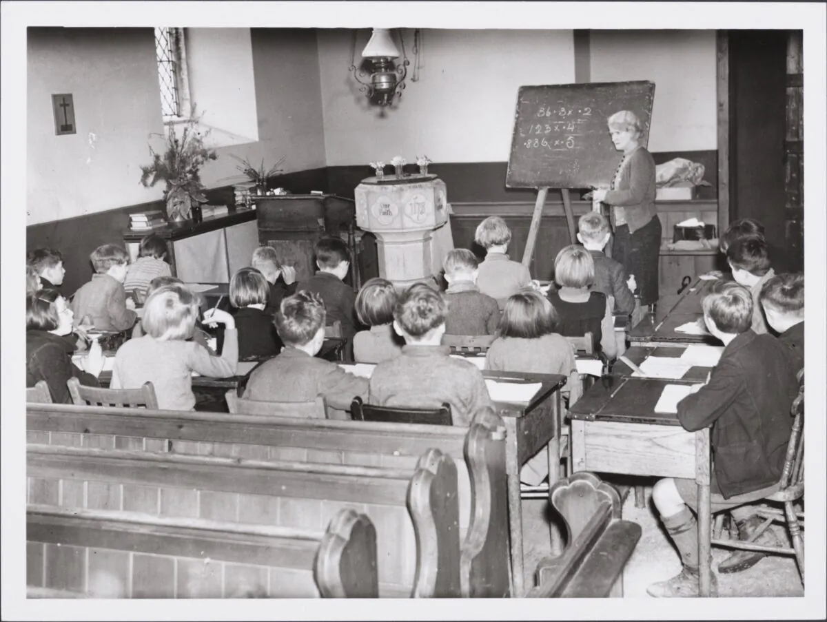 School in a church. Children evacuated from West Ham and Birmingham are using All Saints Church, Bishopswood, Ross on Wye, as a schoolroom, because of lack of accommodation in the school. The church is situated in the heart of the woods in Wye Valley, and when the weather is suitable, the children have their lessons outdoors. (Photo by Hulton Archive/Getty Images)