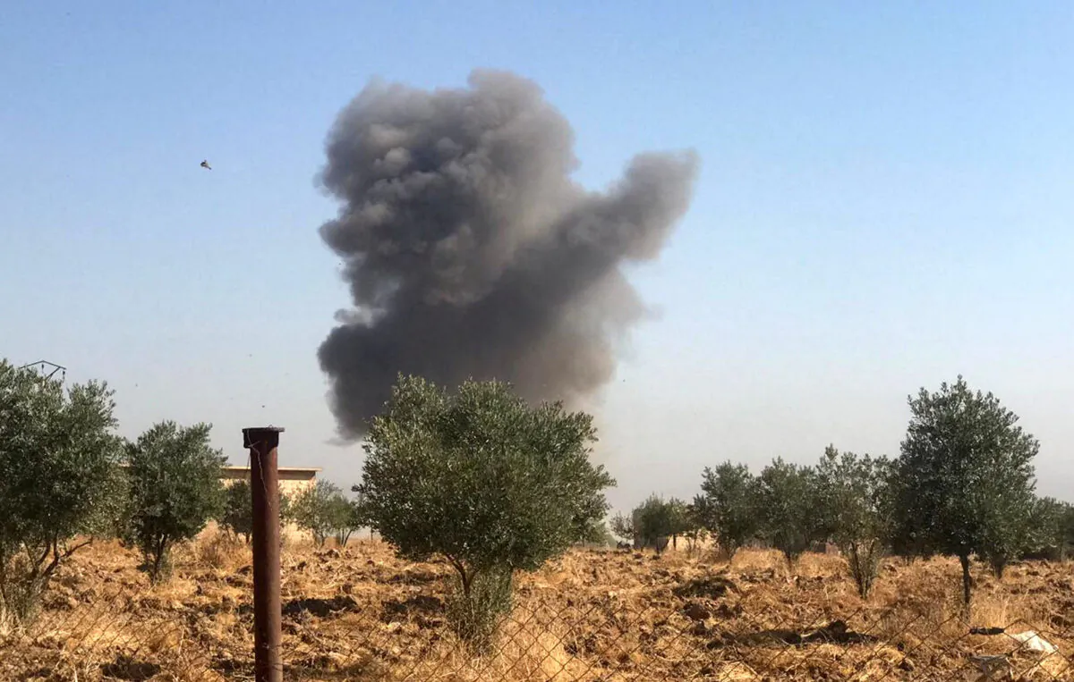 Smoke rises from Tel Arkam village in Ras al Ain countryside, Syria, on Oct. 10, 2019. (Stringer/Reuters)