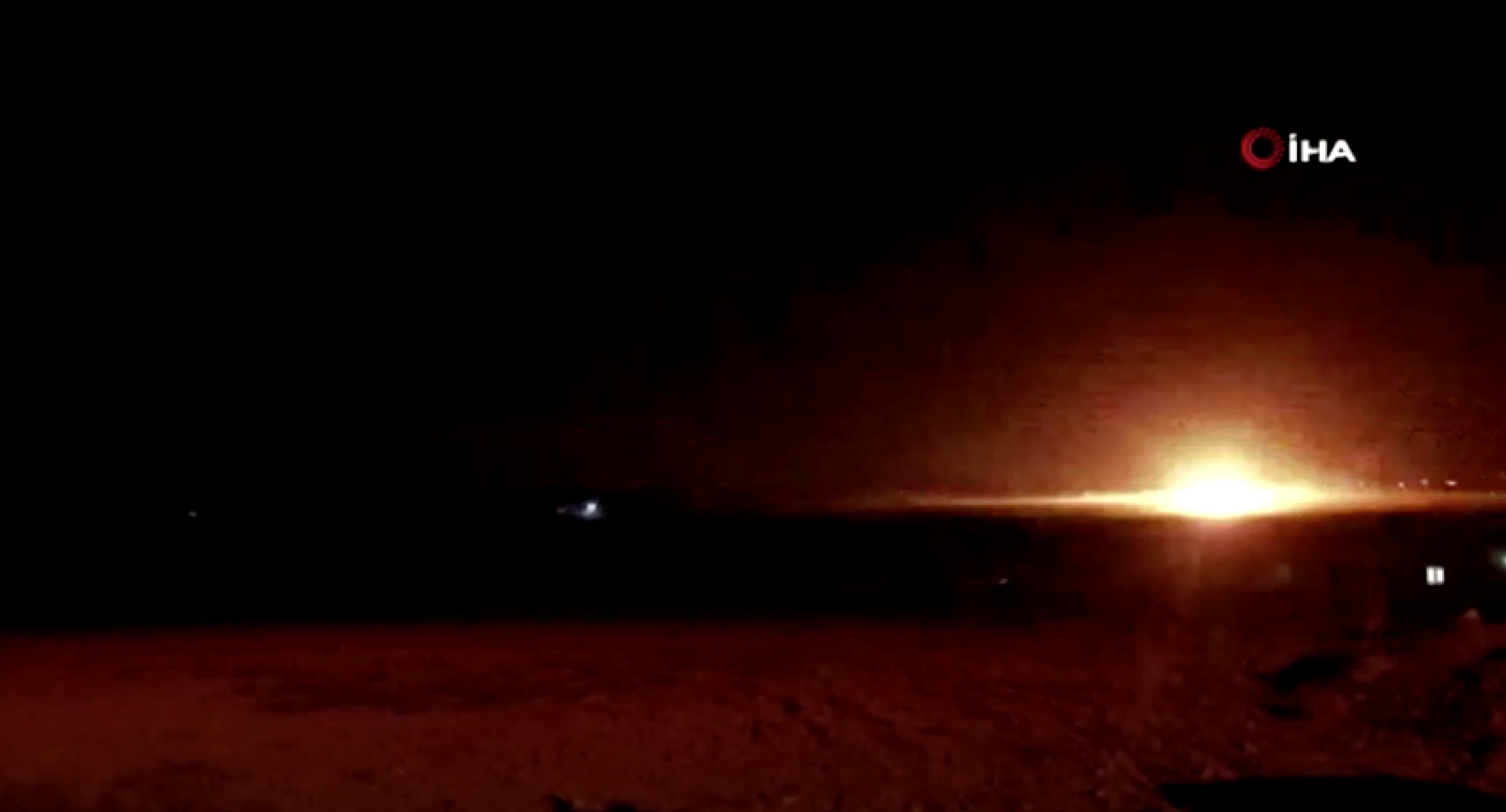 A blast is seen near the border between Syria and Turkey, as seen from Akcakale