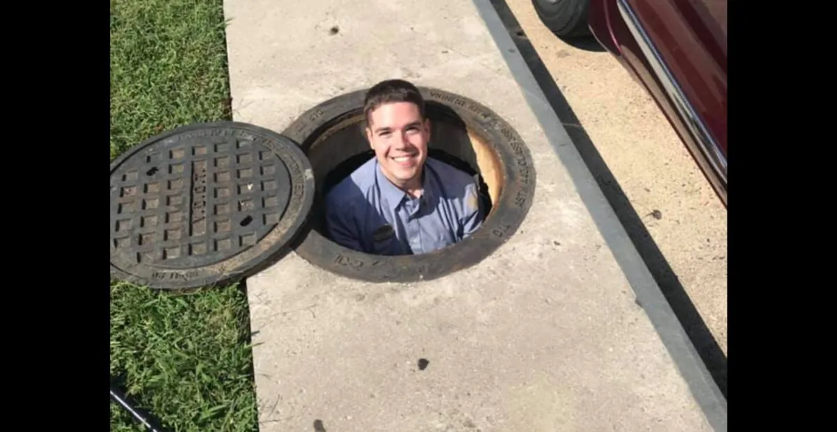 Seth Ratliff, Chick-fil-A's Digital Marketing Director in Stafford, Virginia, jumped down a storm drain to help retrieve a customer's phone on Oct. 1, 2019. (Shauna Hall/Facebook)
