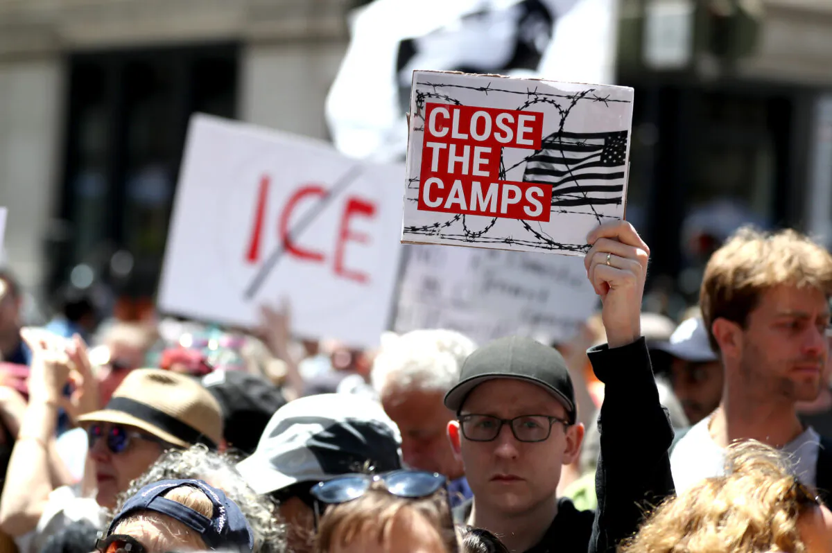 Protesters hold signs during a demonstration against migrant detention facilities on July 2, 2019 in San Francisco, Calif. (Justin Sullivan/Getty Images)