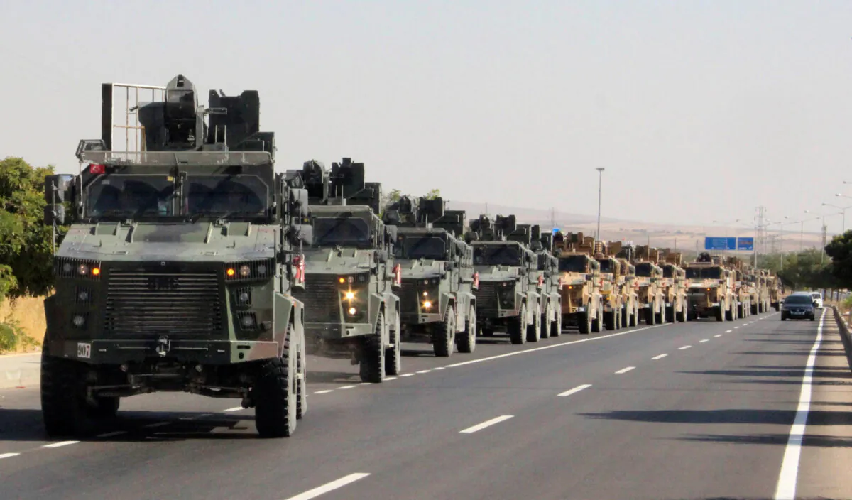 A Turkish miltary convoy is pictured in Kilis near the Turkish-Syrian border, Turkey, Oct. 9, 2019. (Mehmet Ali Dag/ Ihlas News Agency (IHA) via Reuters)