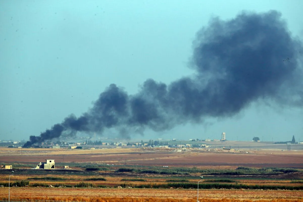 Smoke billows from a fire inside Syria during bombardment by Turkish forces , on Oct. 9, 2019. Turkey launched a military operation Wednesday against Kurdish fighters in northeastern Syria after U.S. forces pulled back from the area, with a series of airstrikes hitting a town on Syria's northern border. (Lefteris Pitarakis/AP Photo)