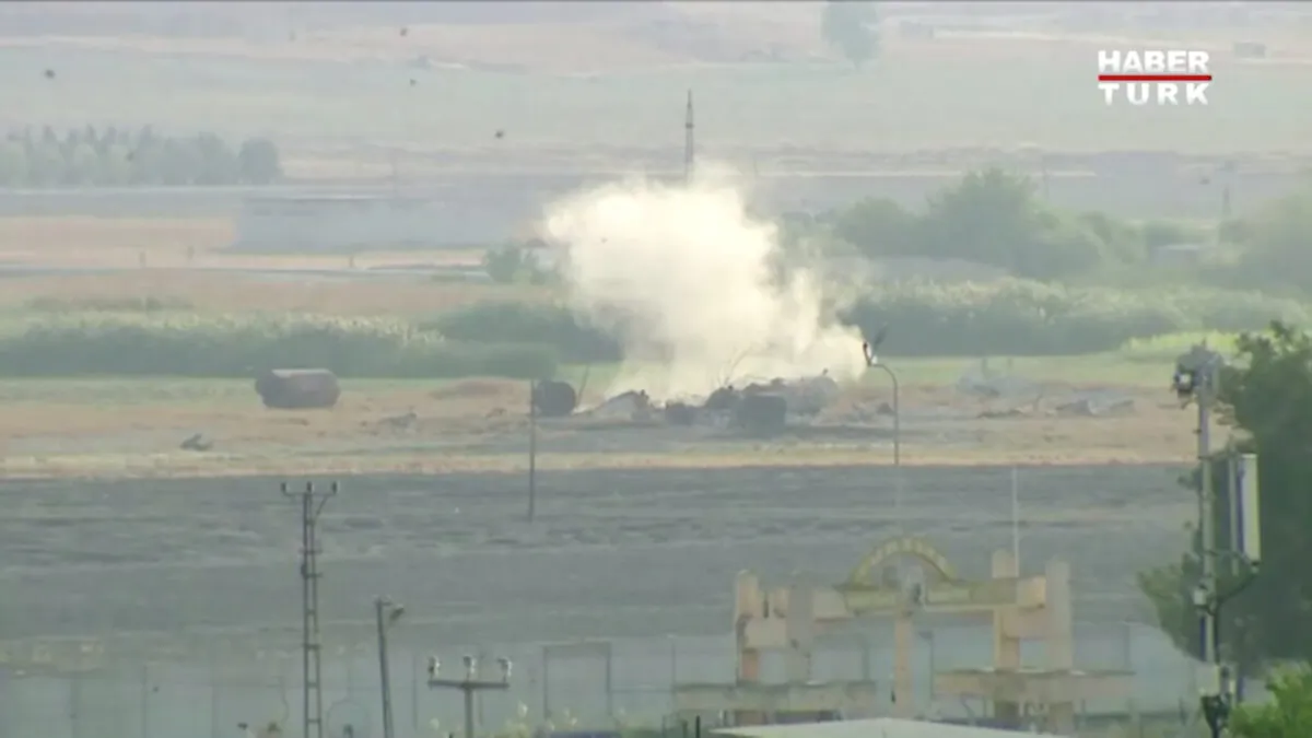 Smoke rises from an explosion in the border town of Tel Abyad, Syria, as seen from Akcakale, Turkey on Oct. 9, 2019. (Haberturk/via Reuters TV)