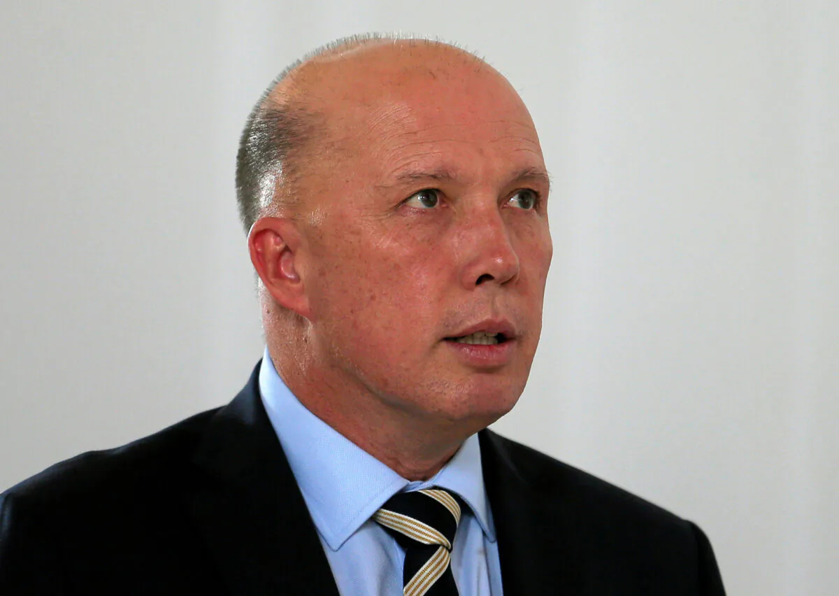 Australian Minister of Home Affairs Peter Dutton inspects the St.Sebastian's church where two Australian citizens died in the Easter Sunday bombing, during his visit in Negombo, Sri Lanka on June 3, 2019. (Dinuka Liyanawatte/Reuters)