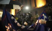 Anti-Trump Protesters in Minneapolis Burn American Flag, MAGA Hats