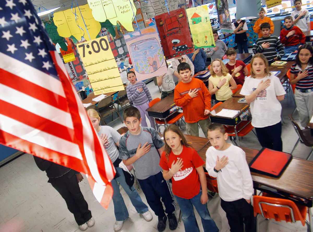 In this file image, fourth graders pledge allegiance to the flag in a Pennsylvania elementary school on March 24, 2004. (William Thomas Cain/Getty Images)