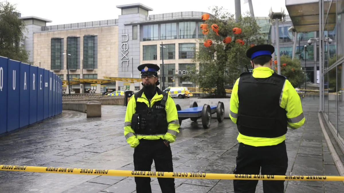 Police outside the Arndale Centre in Manchester, England, on Oct. 11, 2019, after a stabbing incident at the shopping center that left five people injured.(Peter Byrne/PA via AP)
