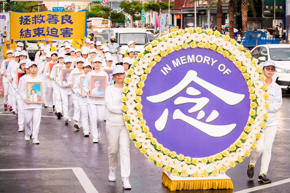 Falun Gong practitioners march in commemoration of the 20th anniversary of the ongoing persecution in China, in Taipei, Taiwan, on July 20, 2019. (Chen Po-chou/The Epoch Times)