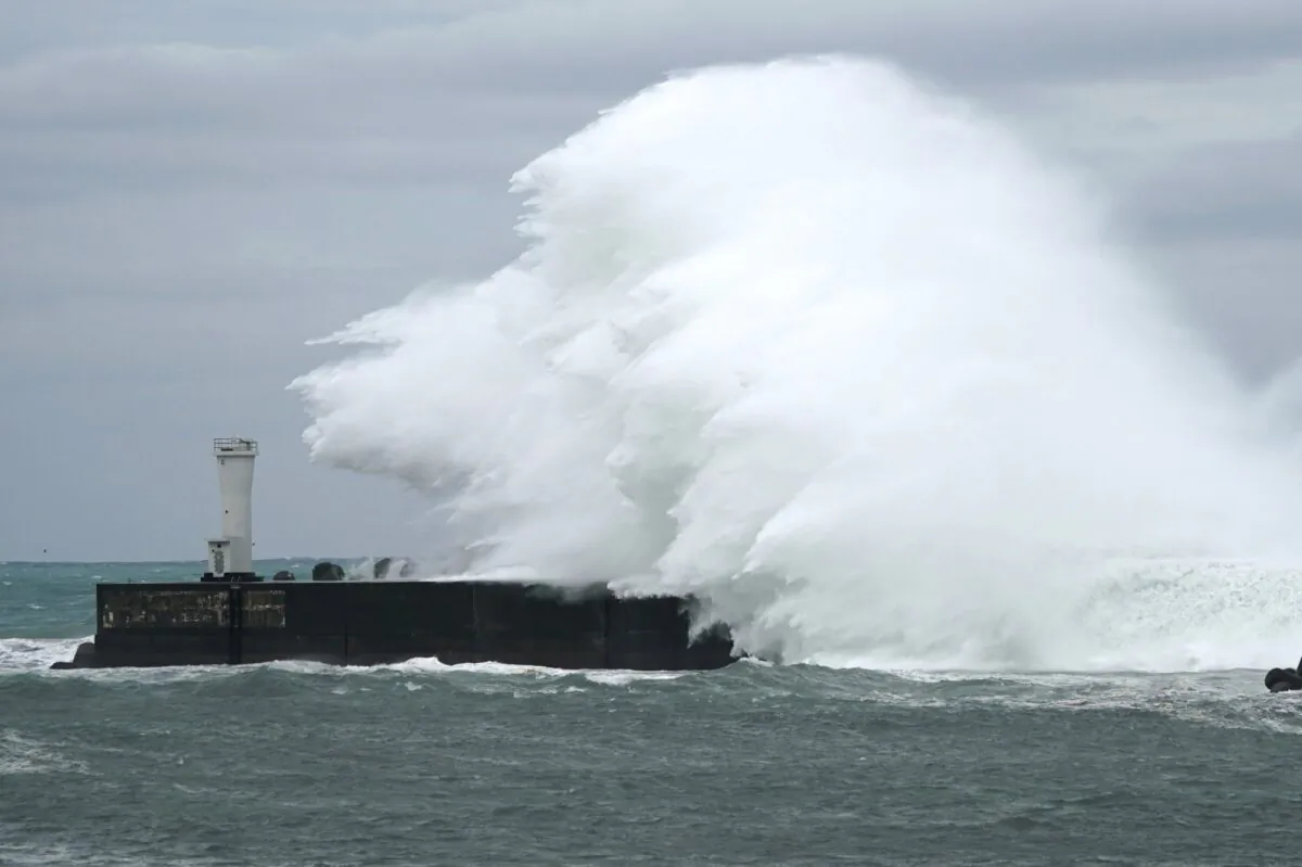 Surging waves hit against the breakwater while Typhoon Hagibis approaches at a port in town of Kiho, Mie prefecture, central Japan, on Oct. 11, 2019. (Toru Hanai/AP Photo)
