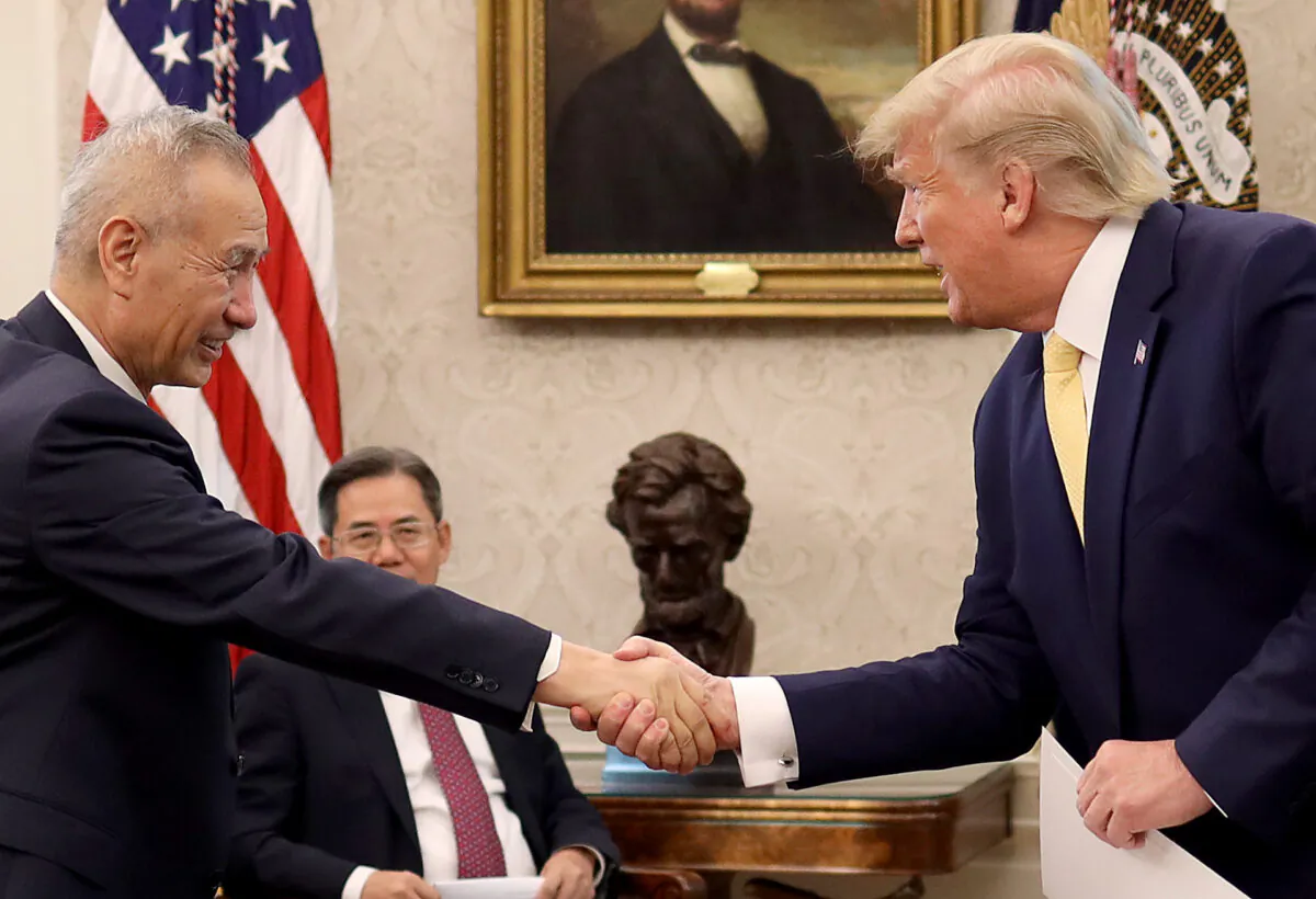 President Donald Trump shakes hands with Chinese Vice Premier Liu He after announcing a "phase one" trade agreement with China in the Oval Office at the White House Oct. 11, 2019 in Washington. (Win McNamee/Getty Images)