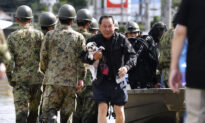 Japan Sends Troops After Deadly Typhoon Floods Towns, Threatens More Damage