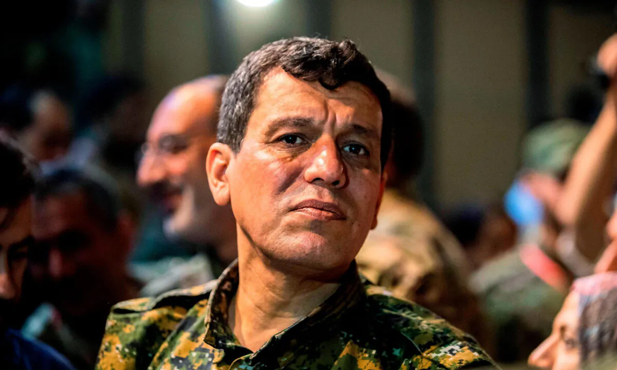 Gen. Mazloum Kobani Abdi, commander-in-chief of the Syrian Democratic Forces (SDF), attends a meeting with other commanders and representatives of the U.S.-led coalition fighting ISIS in a file photograph. (Dell Souleiman/AFP/Getty)
