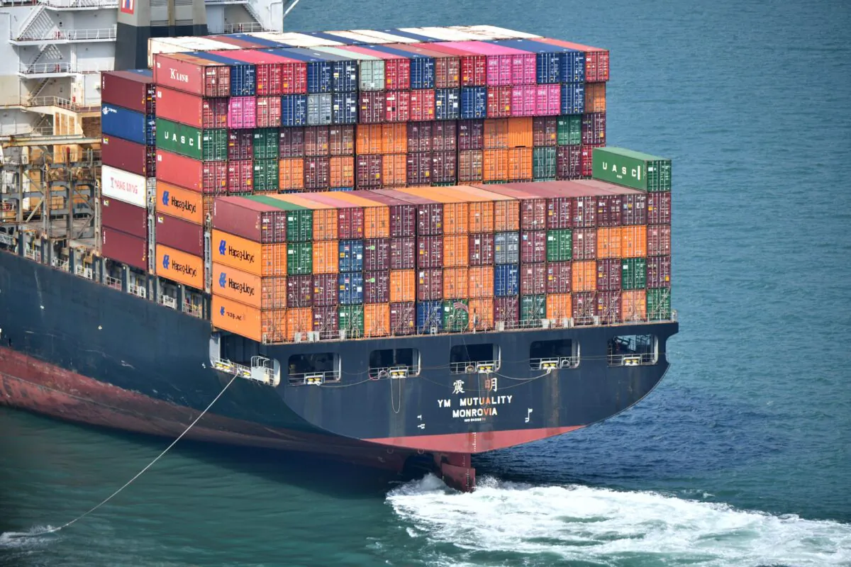 A cargo ship loaded with containers is pictured near the port in Hong Kong on October 5, 2019. (ANTHONY WALLACE/AFP via Getty Images)