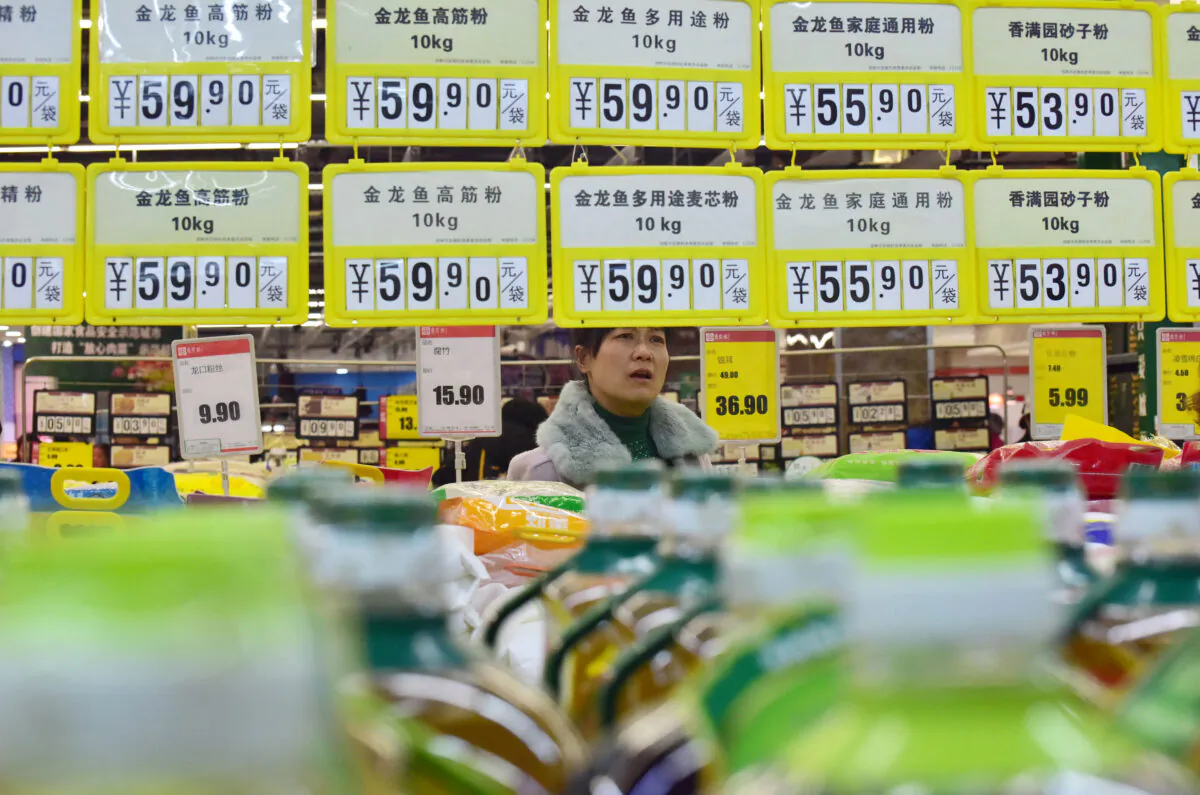 A customer shops at a supermarket in Handan, Hebei Province, China on March 9, 2019. (Reuters)