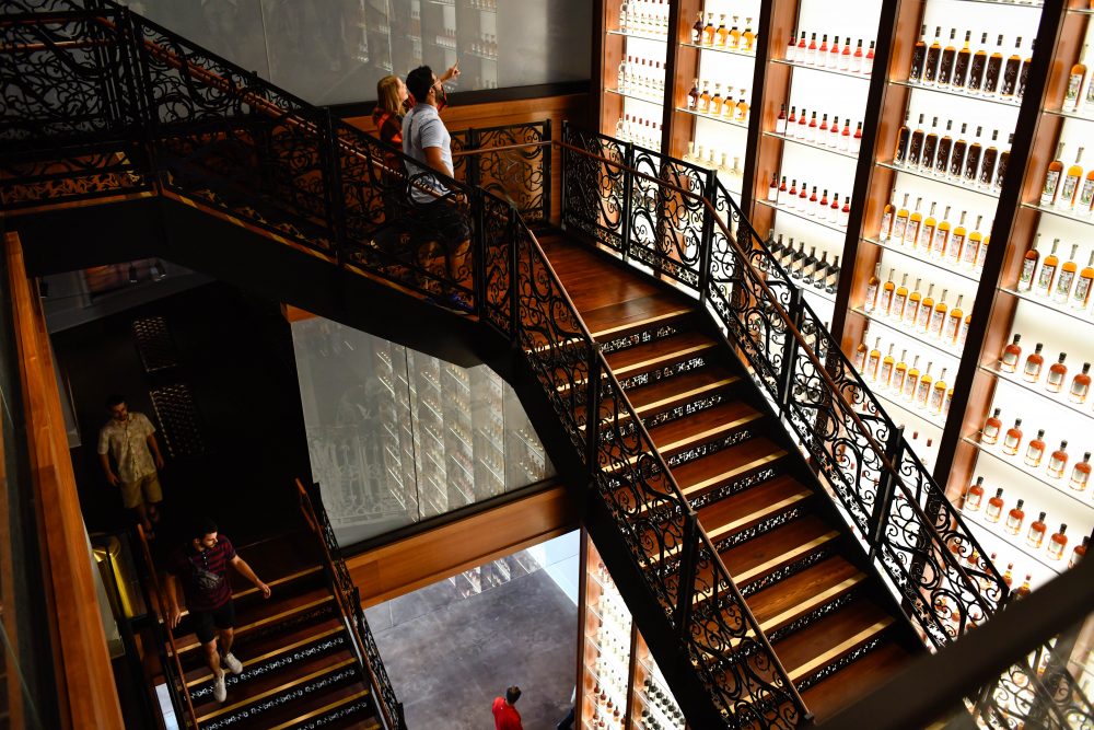 A three-story-tall wall of bottles from the Sazerac Company greets visitors. (Courtesy of the Sazerac House)