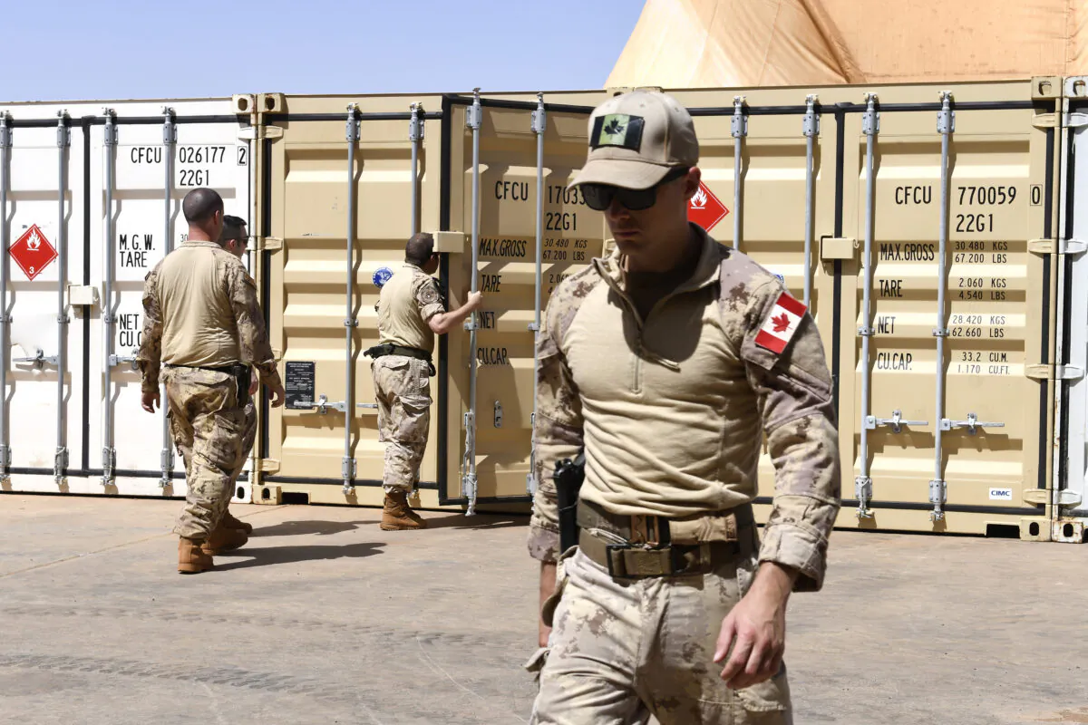 Canadian soldiers unload material at the Castors Camp in Gao, Mali, on Aug. 4, 2018. (Seyllou/AFP/Getty Images)