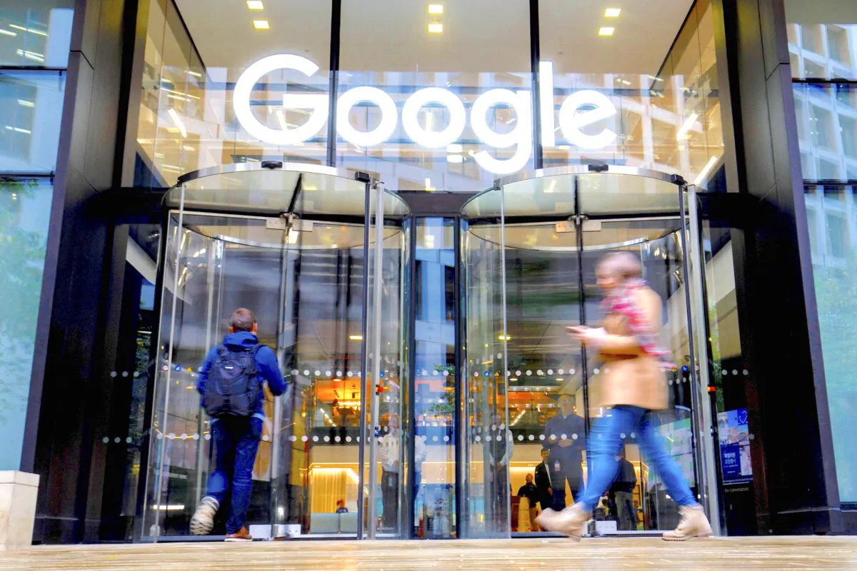 People walk past Google's UK headquarters in London on Nov. 1, 2018. Hundreds of employees walked out of Google's European headquarters in Dublin on Thursday as part of a global campaign over the US tech giant's handling of sexual harassment that saw similar protests in London and Singapore. (TOLGA AKMEN/AFP/Getty Images)