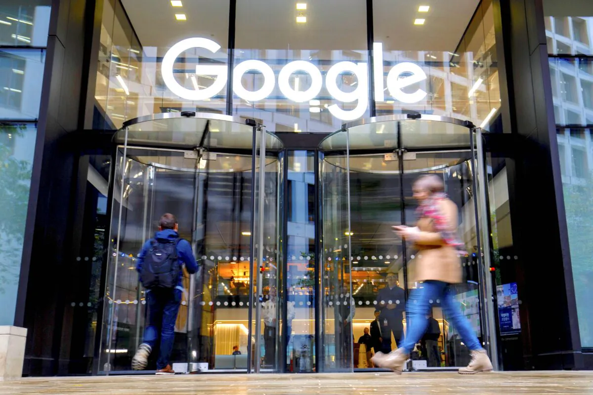 People walk past Google's UK headquarters in London on Nov. 1, 2018. (Tolga Akmen /AFP/Getty Images)