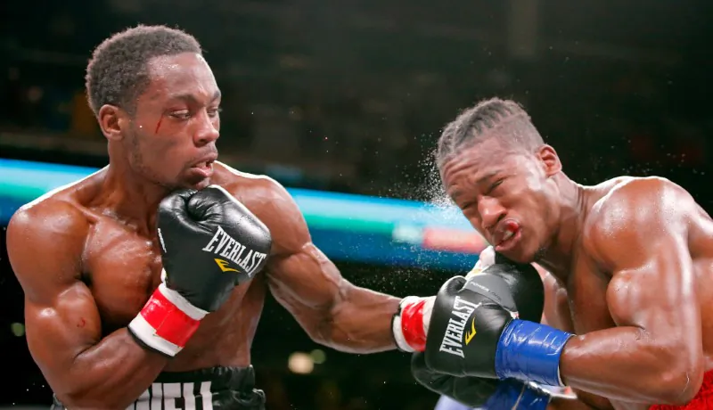 Charles Conwell (black trunks) and Patrick Day (red trunks) box during a USBA Super-Welterweight boxing match at Wintrust Arena in Chicago, Illinois, on Oct 12, 2019. (Jon Durr-USA TODAY Sports)