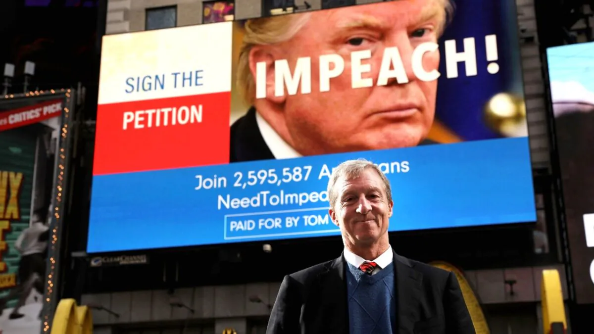 Democratic activist Tom Steyer stands in front of one of the billboards he has funded in Times Square calling for the impeachment of President Donald Trump, in New York City on Nov. 20, 2017. (Spencer Platt/Getty Images)