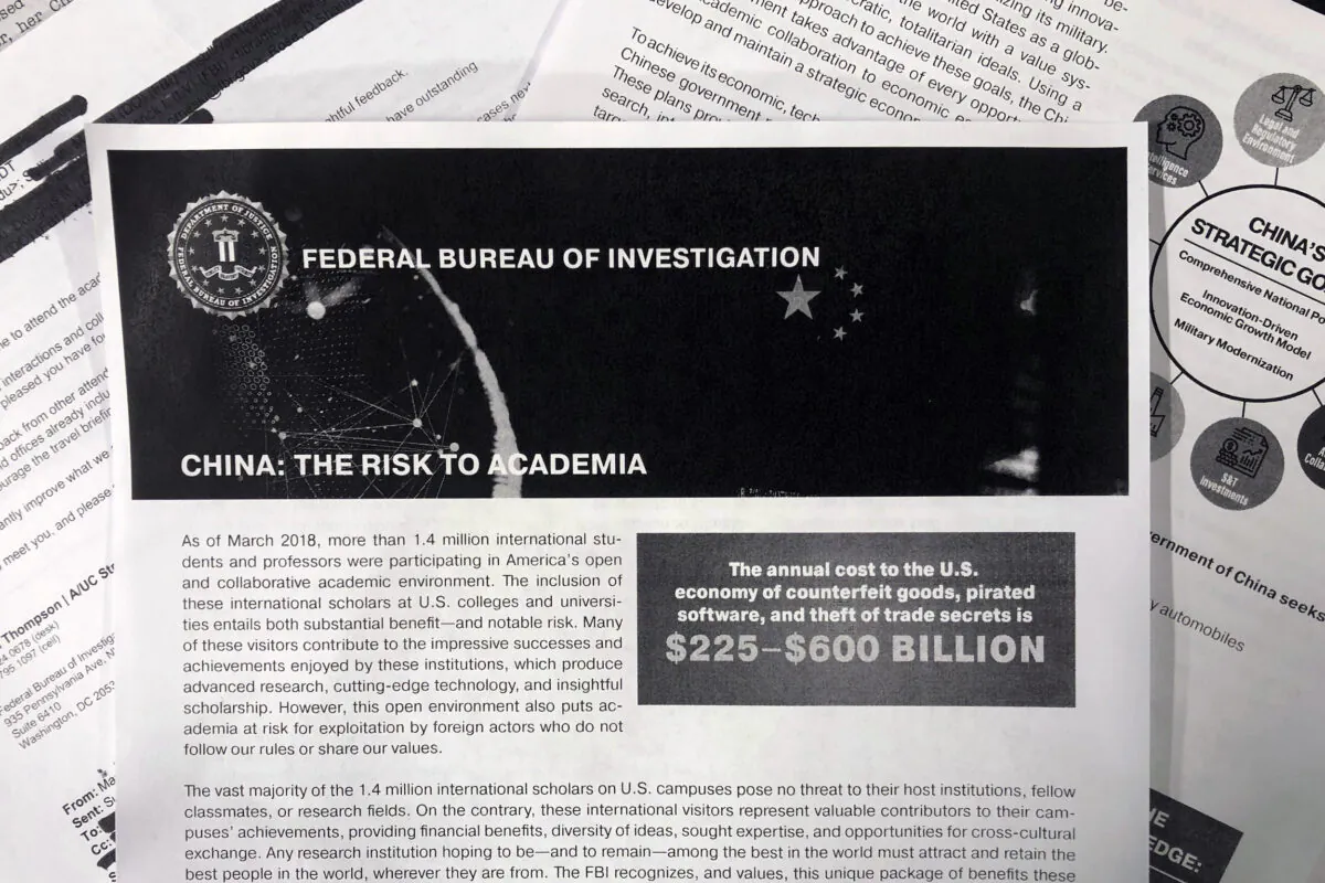 A copy of an FBI pamphlet and related emails in this photo taken on Oct. 4, 2019. The Trump administration says it will soon require Chinese officials in the U.S. to notify the State Department ahead of any contacts they plan to have with American educators, researchers and local and state governments. (AP Photo)