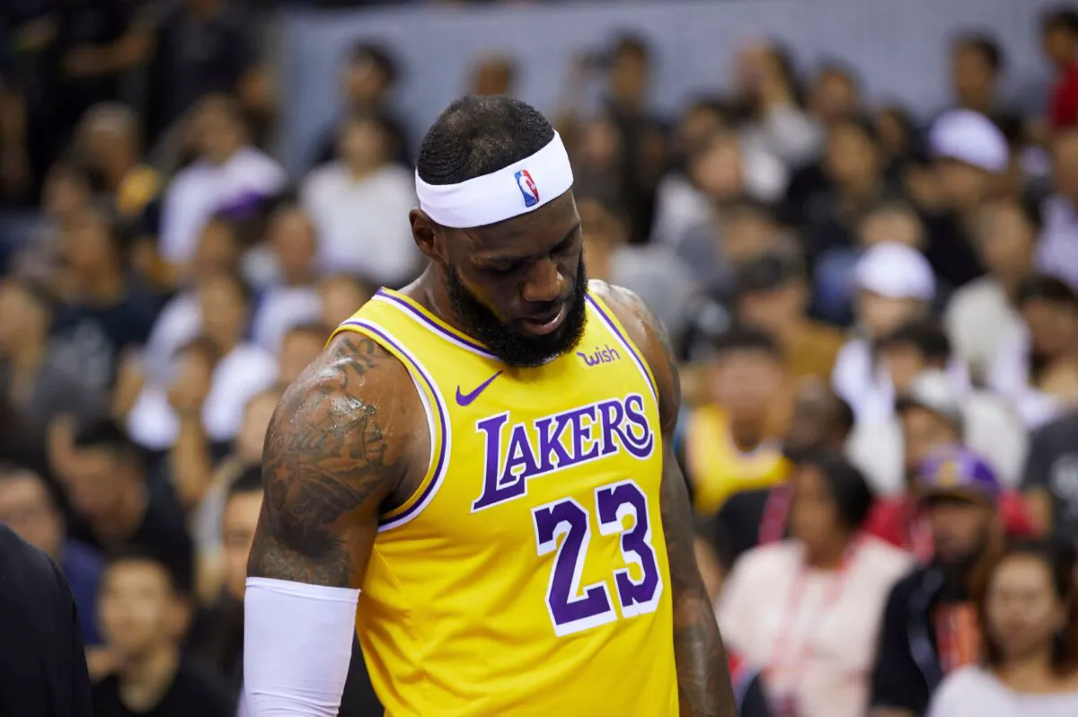 LeBron James reacts during a pre-season game between the Los Angeles Lakers and Brooklyn Nets in Shenzhen, in China's southern Guangdong Province, on Oct. 12, 2019. (STR/AFP via Getty Images)