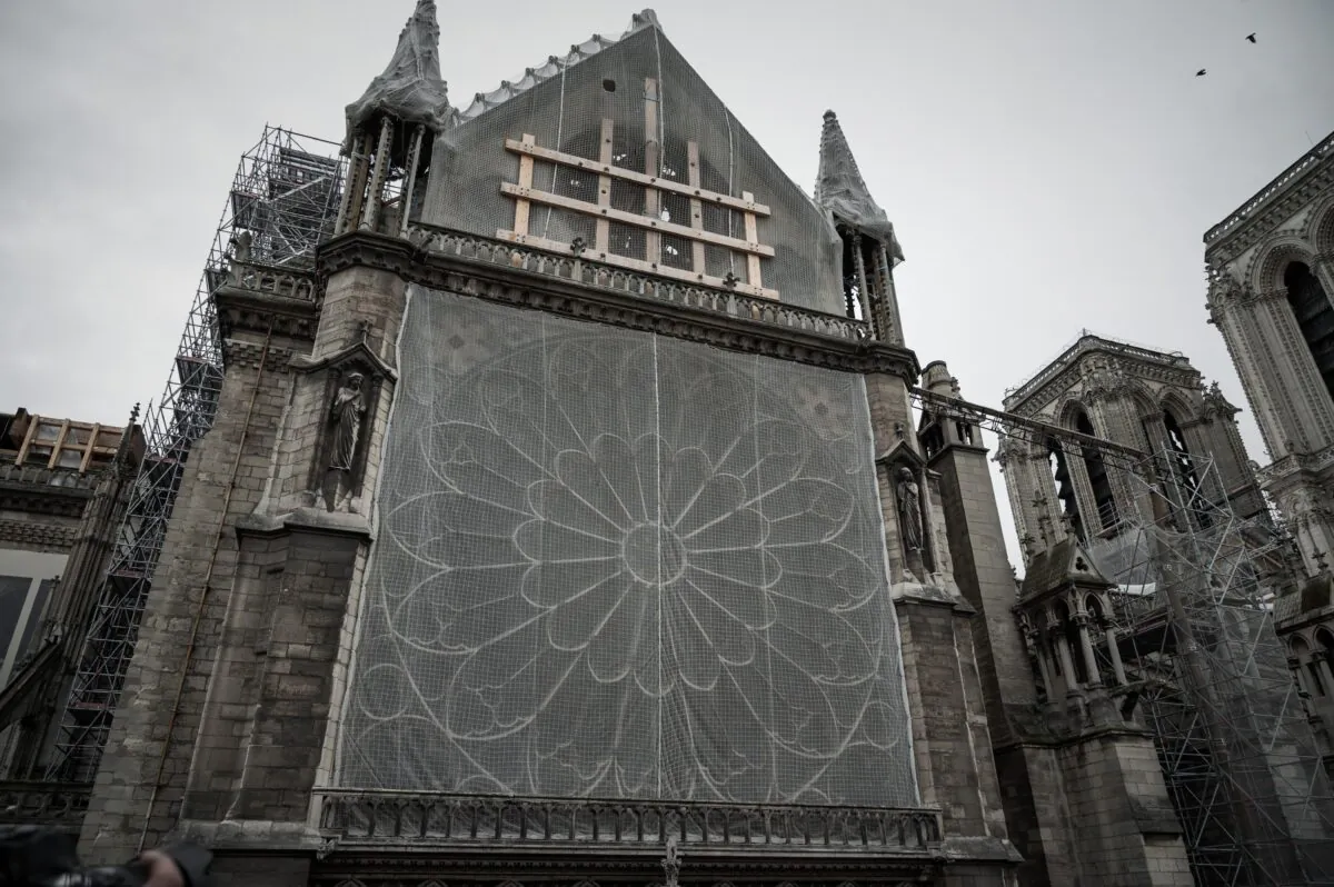 This picture taken on October 15, 2019 shows wood structures, protection nets and scaffolding at the Notre-Dame Cathedral in Paris, six months after the April 15 blaze. (Philippe Lopez/AFP via Getty Images)