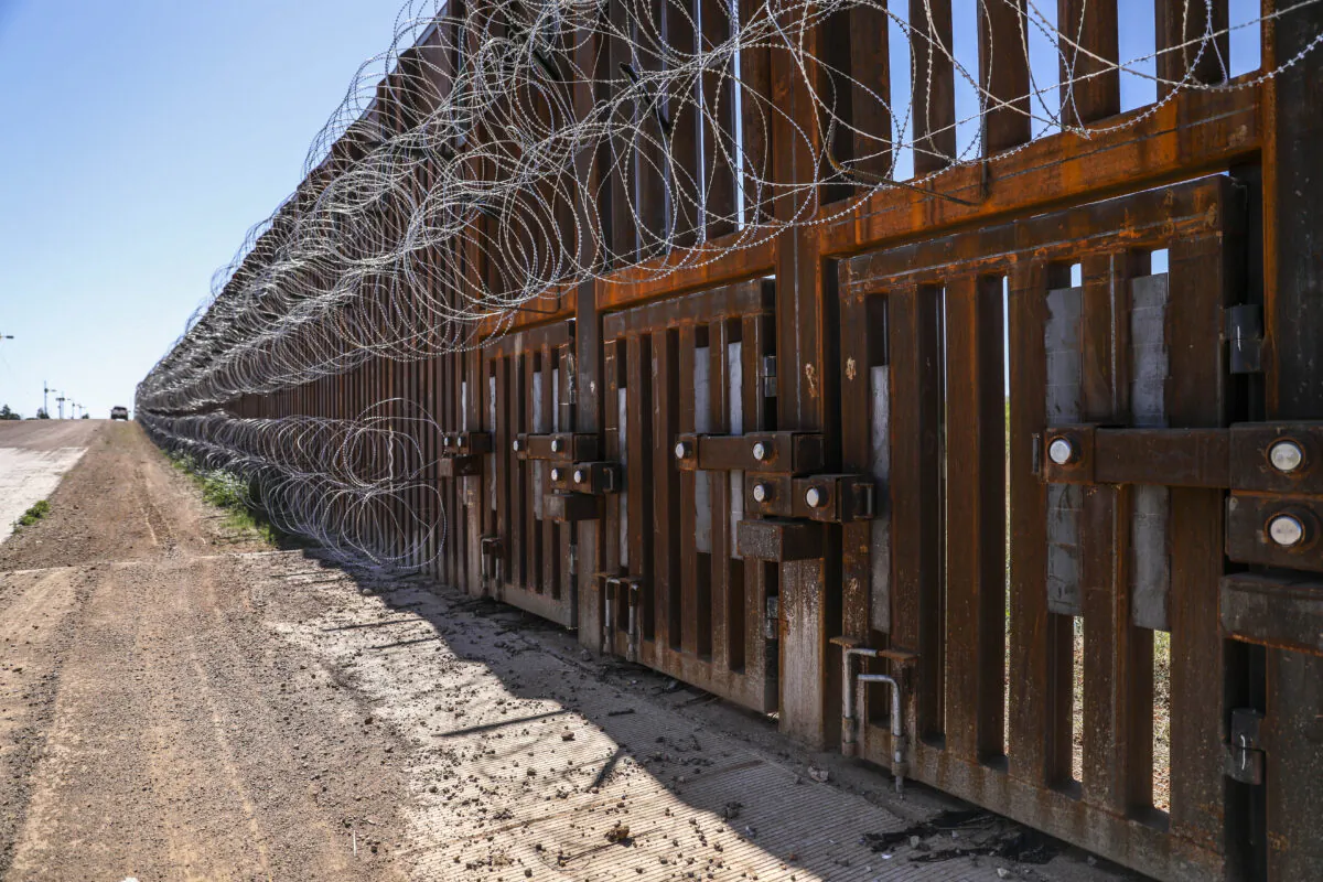 The flood gates sit within the U.S.-Mexico border fence west of Naco, Arizona, on May 8, 2019. (Charlotte Cuthbertson/The Epoch Times)
