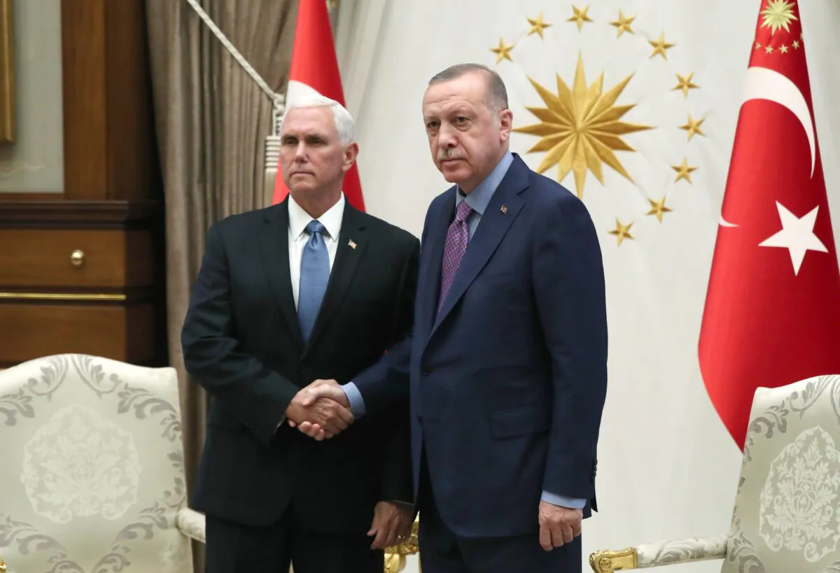 In this handout image provided by the Turkish presidency, Turkish President Recep Tayyip Erdogan receives U.S. Vice President Mike Pence at Presidential Complex in Ankara, Turkey on Oct. 17, 2019. (Murat Cetinmuhurdar/Turkish Presidency via Getty Images)