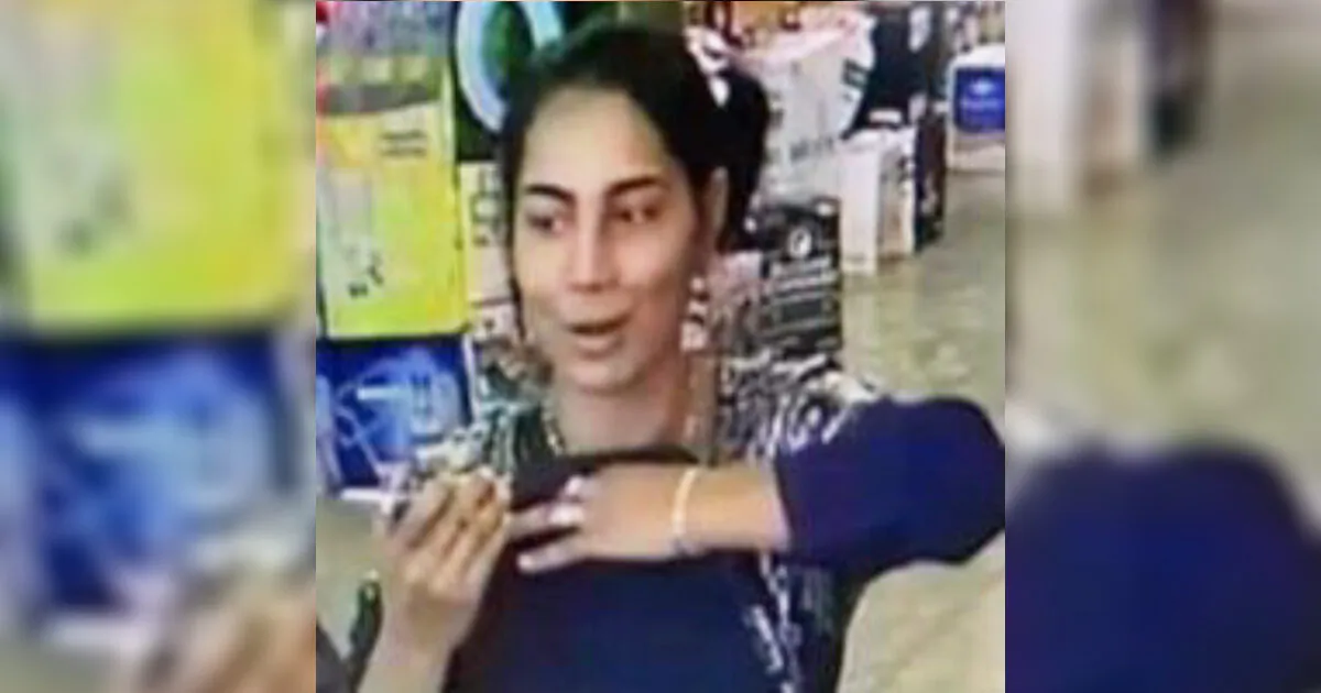 The unknown woman who police say robbed a liquor store with the help of a young child. (Denver Police Department)