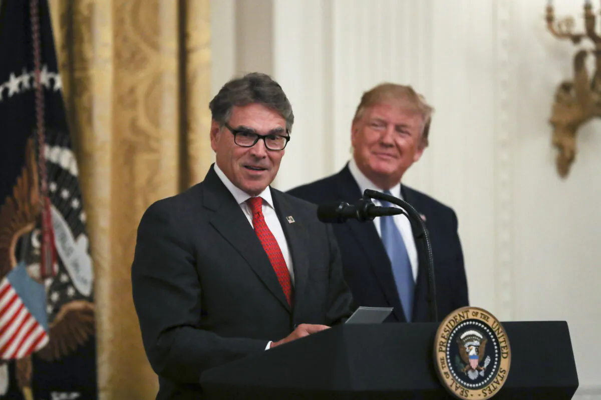 Secretary of Energy Rick Perry and President Donald Trump at the administration's environment initiative event in the East Room of the White House in Washington, D.C., on July 8, 2019. (Charlotte Cuthbertson/The Epoch Times)