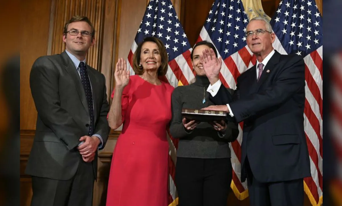 House Speaker Nancy Pelosi of Calif., second from left, poses during a ceremonial swearing-in with Rep. Francis Rooney, R-Fla., right, on Capitol Hill in Washington on Jan. 3, 2019. (Susan Walsh/AP Photo) 