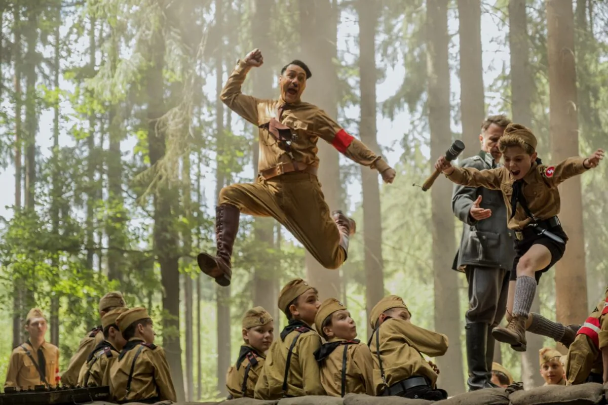 Adolph (Taika Waititi, center, above), the imaginary friend of Jojo (Roman Griffin Davis) in “Jojo Rabbit.” (Fox Searchlight)