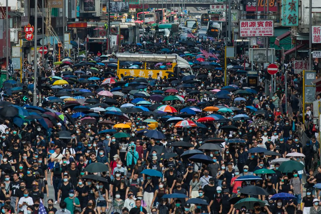 People march along the main road in Mong Kok as they take part in a pro-democracy march from Tsim Sha Tsui in the Kowloon district in Hong Kong on Oct. 20, 2019. (Philip Fong/AFP via Getty Images)