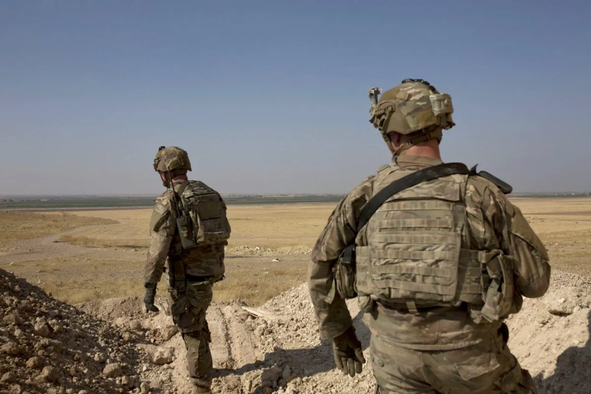 U.S. soldiers survey the safe zone between Syria and the Turkish border near Tal Abyad, Syria, on a joint patrol with the Tax Abyad Military Council, affiliated with the U.S.-backed Syrian Democratic Forces on Sept. 6, 2019. (Maya Alleruzzo/AP Photo)