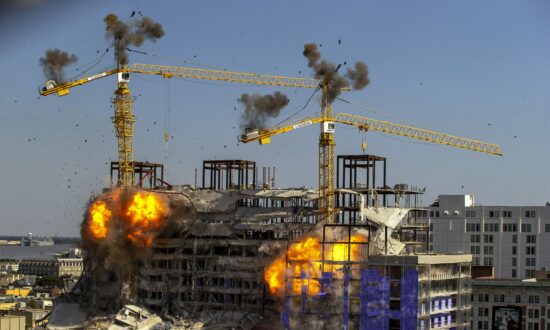 2 Leaning Cranes Toppled at Partly Collapsed New Orleans Hotel