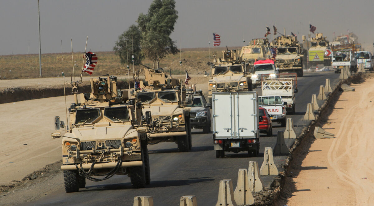 A convoy of U.S. vehicles is seen after withdrawing from northern Syria, on the outskirts of Dohuk
