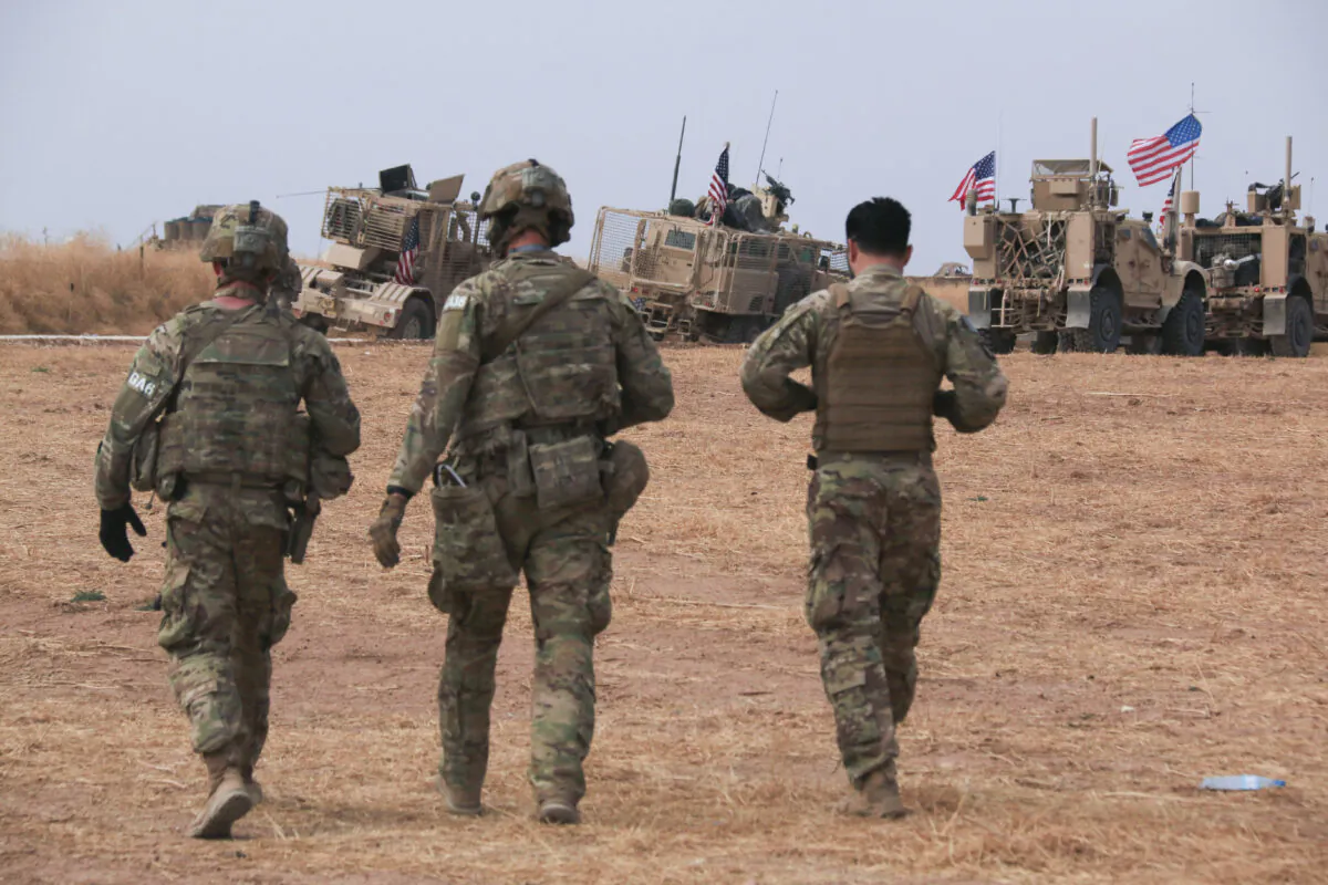 An American military convoy stops near the town of Tel Tamr, north Syria on Oct. 20, 2019. (AP Photo/Baderkhan Ahmad)