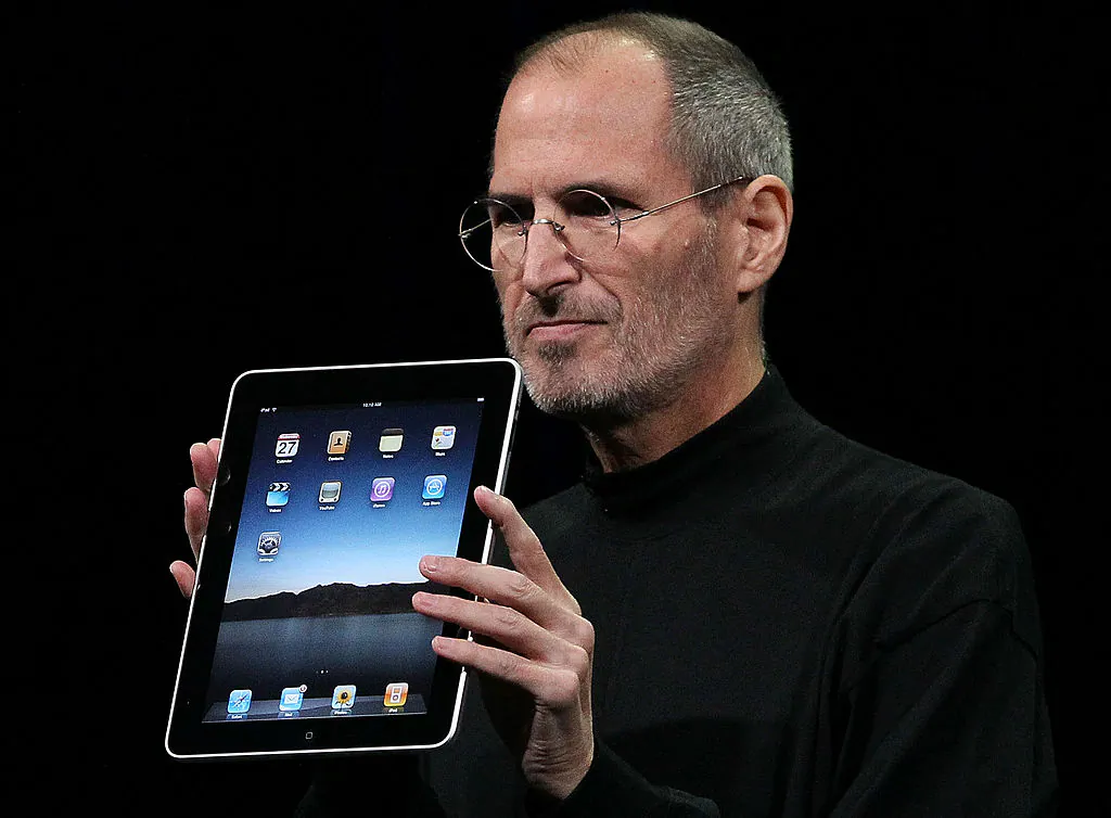 Apple Inc. CEO Steve Jobs holds up the new iPad as he speaks during an Apple Special Event at Yerba Buena Center for the Arts in San Francisco, Calif., on Jan. 27, 2010. (Justin Sullivan/Getty Images)