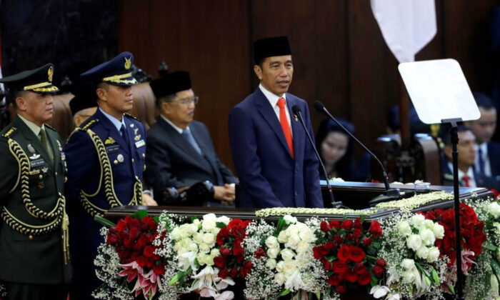 Indonesian President Joko Widodo delivers a speech after taking his oath during his presidential inauguration for the second term, at the House of Representatives building in Jakarta, Indonesia, on Oct. 20, 2019. (Adi Weda/Pool via Reuters)