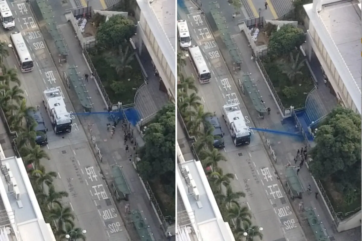 Camera equipped on The Epoch Times' drone captures the moment police fired a water cannon at the Kowloon Masjid and Islamic Center with blue dye when a few people were standing in front of the mosque on Oct. 20, 2019. (The Epoch Times)