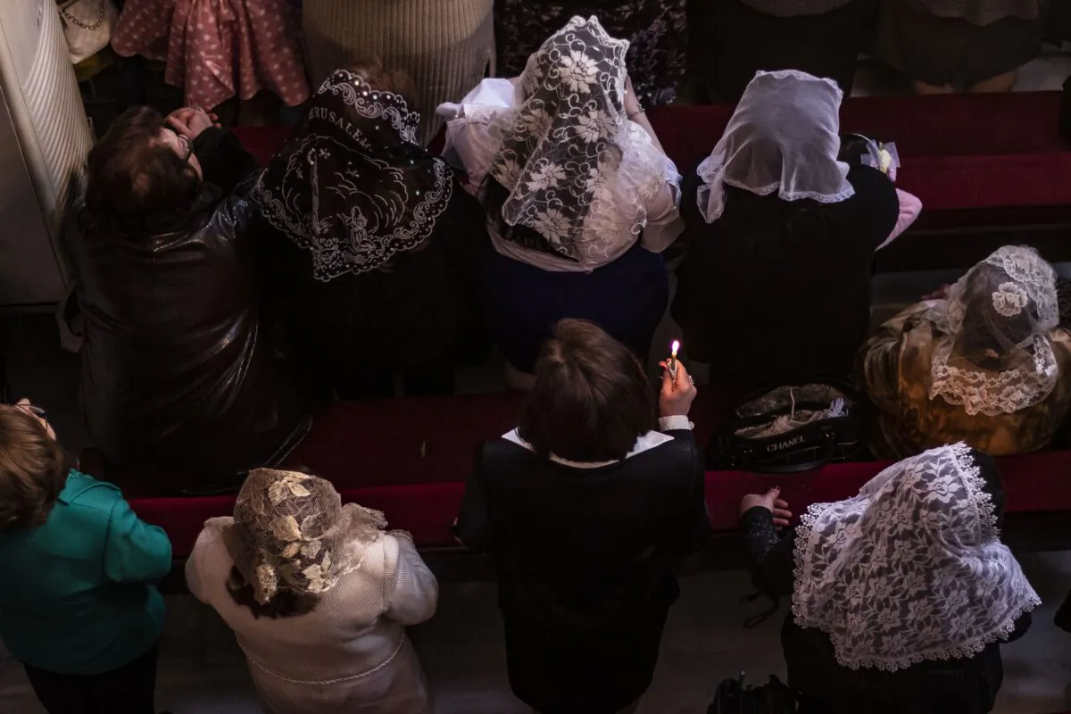Syriac Christians take part in Palm Sunday celebrations at the Syriac Orthodox Church of the Virgin Mary in the northeastern Syrian Kurdish-controlled city of Qamishli, on April 21, 2019. (DELIL SOULEIMAN/AFP/Getty Images)