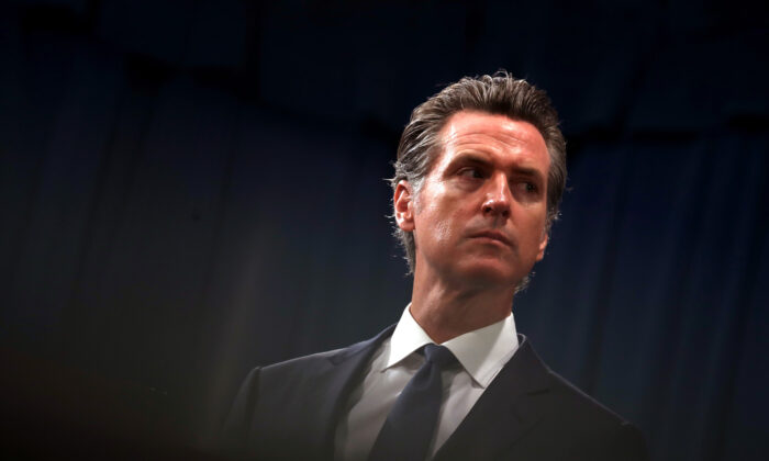 California Gov. Gavin Newsom looks on during a news conference in Sacramento on Aug. 16, 2019. (Justin Sullivan/Getty Images)