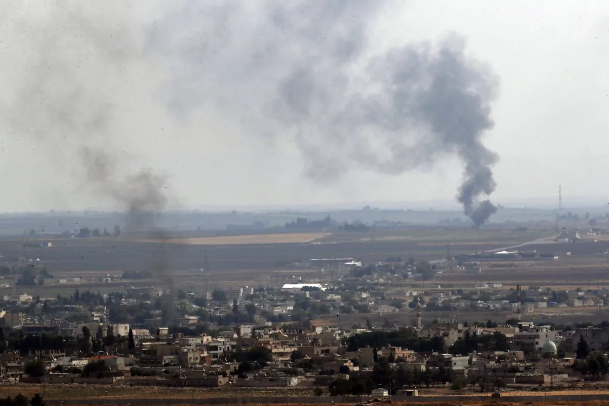 Smoke billows from fires in Ras al-Ayn, Syria, on Oct. 20, 2019. (Lefteris Pitarakis/AP Photo)