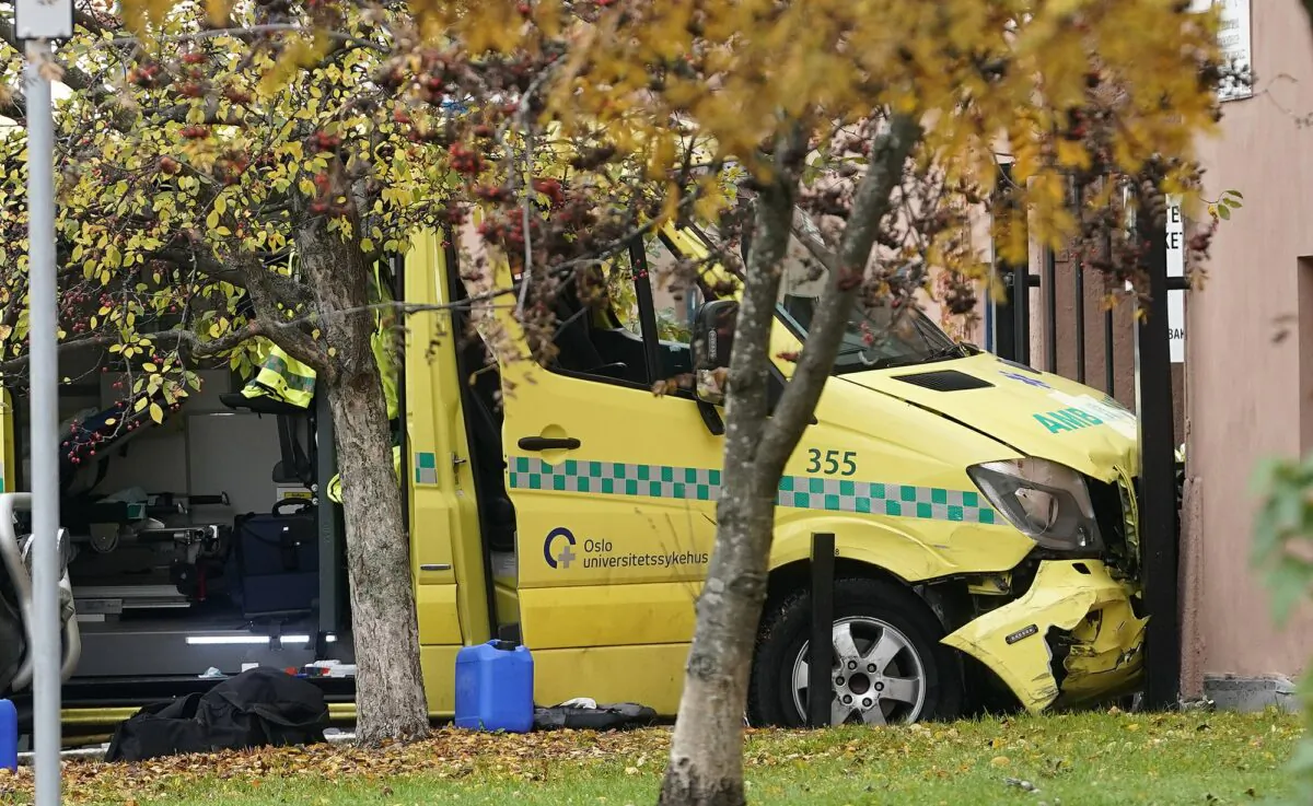 A damaged ambulance is seen crashed into a building after an incident in the center of Oslo on Oct. 22, 2019. (Stian Lysberg Solum/NTB scanpix via AP)