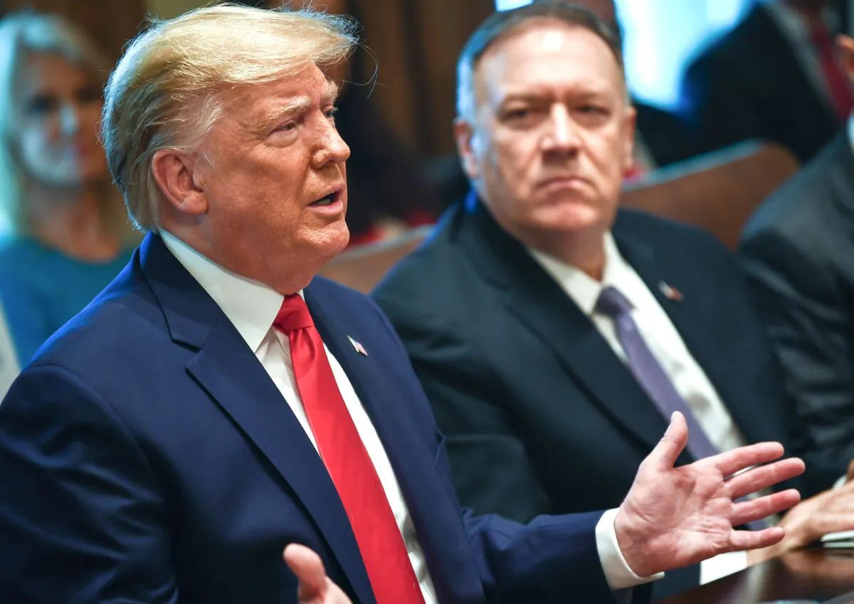 President Donald Trump (L) speaks next to Secretary of State Mike Pompeo during a Cabinet Meeting at the White House on Oct. 21, 2019. (Brendan Smialowski/AFP via Getty Images)